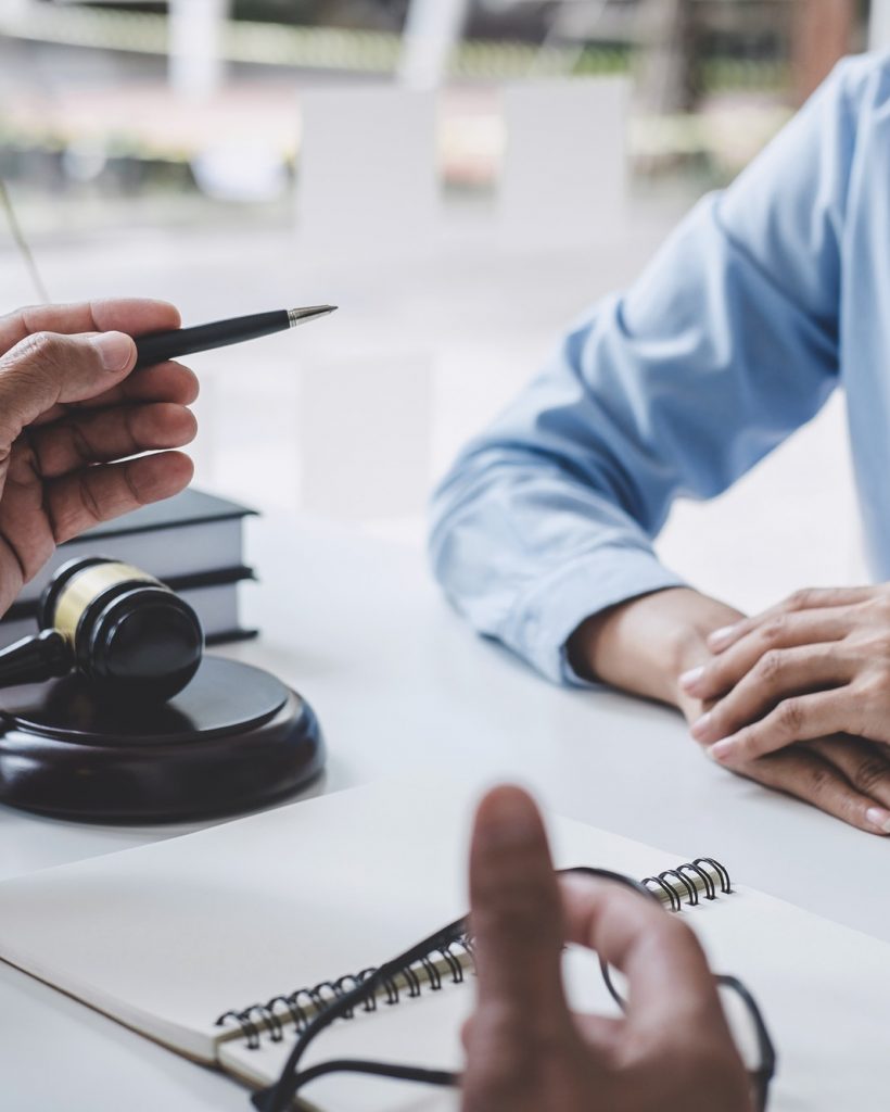 consultation-and-conference-of-male-lawyers-and-professional-businesswoman-working-and-discussion.jpg